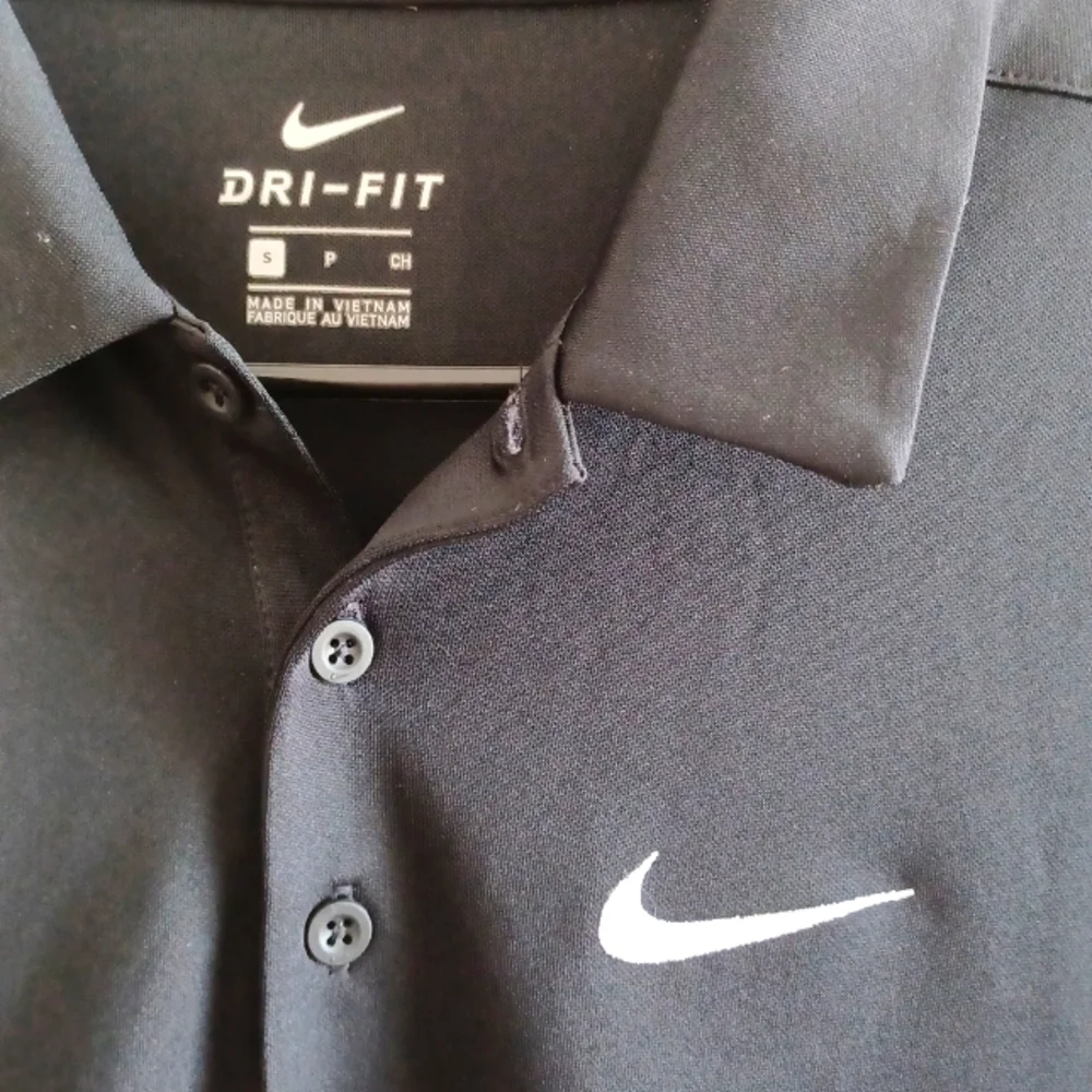 NIKE Breathe Polo Shirt.
